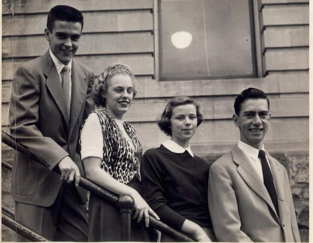 Four people from the class of 1951. Standing from left to right are: William Sullivan, Claire Ducharme, Lucille Brunelle, and Fran Laposta. They are outside but exactly where is not known. 첥 Junior College.